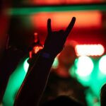 Crowd enjoying live music near St Kilda beach at sunset